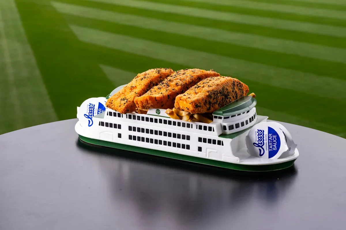 Ball game bites take a healthier turn at the Seattle Mariners T-Mobile Park, where offerings include the Copper River 3-Piece Salmon and Chips, served with Ivar’s signature tartar sauce atop a ferry boat carrier.
