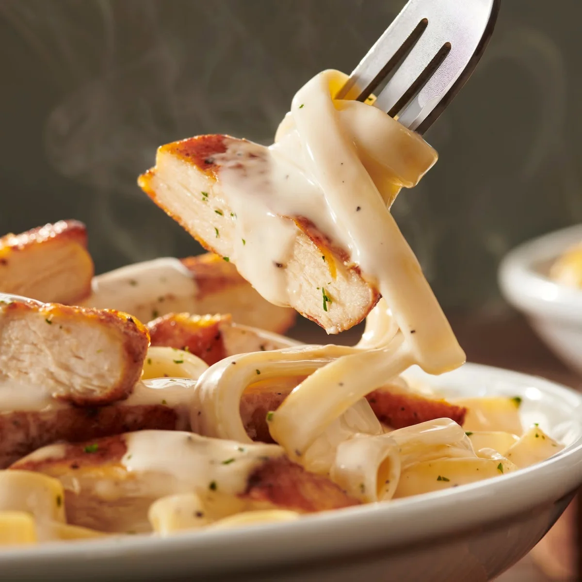Olive Garden's simple but iconic Fettuccine Alfredo delivers cheesy comfort and a hearty meal—top-of-mind considerations for some cash-strapped Gen Zers.
